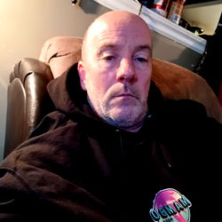 A Man Sitting in His Living Room