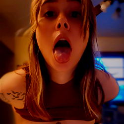 OnlyFans Model in Playful Pose, Sticking Tongue Out