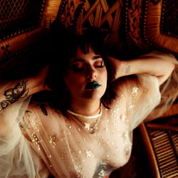 Asphyx - Elegant, Gothic Model Posing on Chair