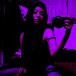 Purple Hues: A Stylish Model Captures Herself