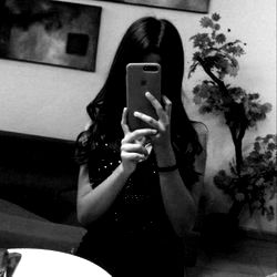 A Model in a Bathroom Mirror