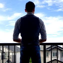 Casually Dressed Man Standing Outdoors