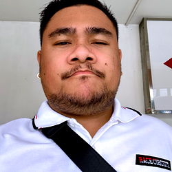 BK_bear, Man Looking Directly at Camera with Slight Frown, White Tee and Short Hair