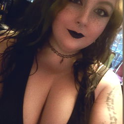 Lady with Dark Hair, Heavy Eye Makeup, and Choker