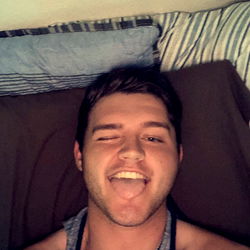 Wyatt on a Couch Taking a Selfie