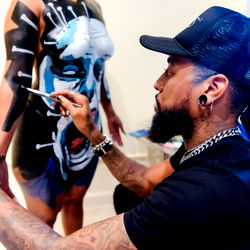Artist Applying Ink for Face Painting
