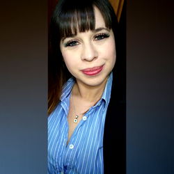 Model in Striped Shirt Posing with Hand on Hip