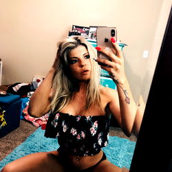 Fitness model Staci Rose in a blue turquoise room