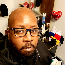 Man in Glasses Standing in Room