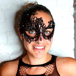 Annabella Prigione, the captivating beauty in a striking mask and costume