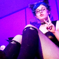 Model AlisterGrey Posing in Playful Fashion