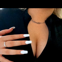 Babii Showing Her Perfectly Manicured Fingernails and Cleavage in OnlyFans Model Photo