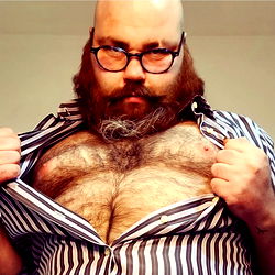 Bearded Man with Glasses Displaying Chest Hair