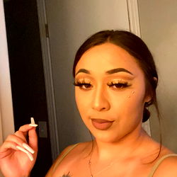 Onlyfans model Annxkai poses with cigarette and tattoos
