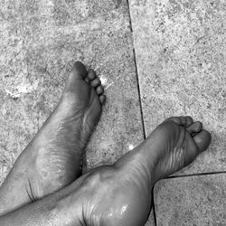 Feet in a Tile Floor