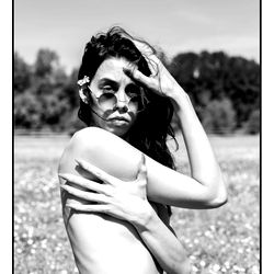 Model with a Shirtless Shoot in an Open Field