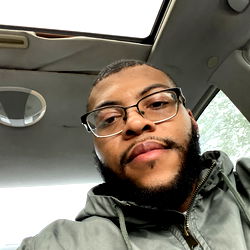 A Young Adult Male in a Car