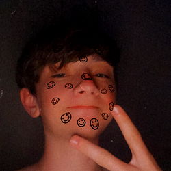 Young Man Posing with Peace Sign