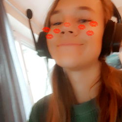 Young Female Gamer Smiling at Camera