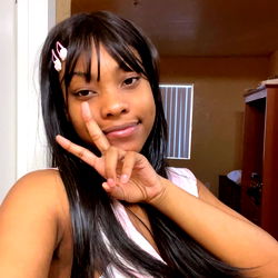 Asia, the young woman with long hair and a pink top posing for a photo.