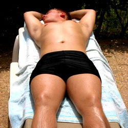 Relaxed Man Enjoying Poolside Sunbath