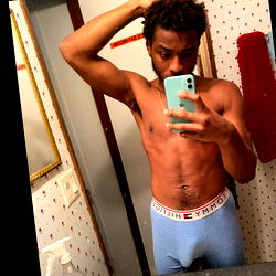 Stylish Model Posing in Bathroom Mirror