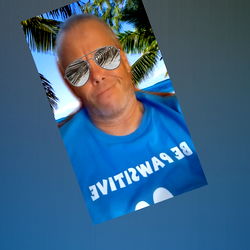 Handsome Man in Sunglasses, T-Shirt and Blue Shorts