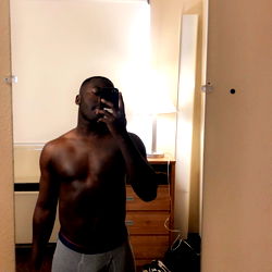 Black Panther, OnlyFans Model, Shows Off His Physique in a Motel Mirror