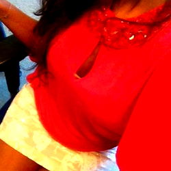 Model Sherazade in a Red and Pink Dress