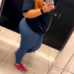 A Model Posing for a Photograph in a Restroom