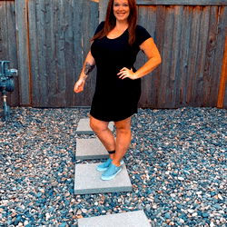 Ashley C, a fitness enthusiast posing outdoors