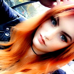 Ash's Stunning Red Hair Look in a Black Jacket