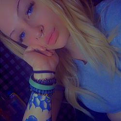 A Tattooed Individual in a Cozy Setting