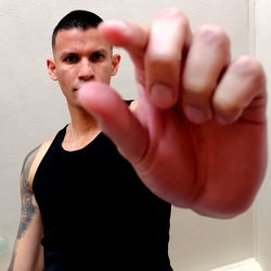 Strong Fitness Model Ricko Showing Finger