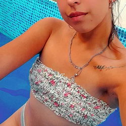 Ayelen, an Onlyfans model posing on a pool float