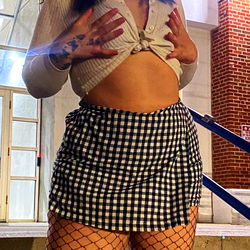 Aries Baby's Stylish Ensemble: Blue Plaid Skirt and Fishnet Tights