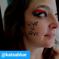 Vivid Rainbow Makeup on Face with 'Love is Love' Message,