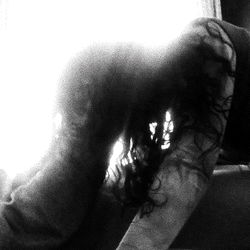 An artistic black and white image of a woman