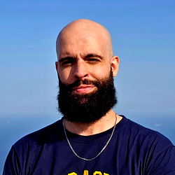 Bald Man with Beard in a Blue Shirt