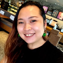 A Smiling Woman at a Cafe