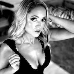 Ana, an OnlyFans model in a revealing black lingerie