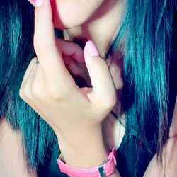 Jenni 🦋 Finger-pointing at her finger with pink nail polish on it.