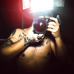 Man Taking Selfie with Camera Flash