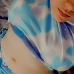 Lil G: A Glamourous OnlyFans Model in a Blue Cloud Tank Top