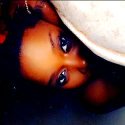 AyoSmiley, a young adult woman in the image.