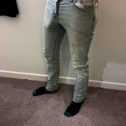 Jack, a OnlyFans Model Posing in Casual Fashion with Tattoos