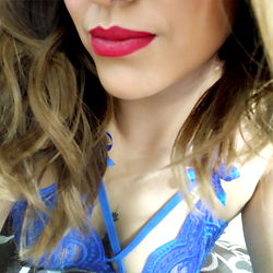 Vibrant Model with Red Lipstick and Blue Bra