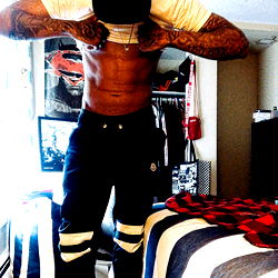 Model in gym attire, showing off fit body