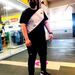 Stylish Young Man in Black and White Sneakers