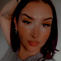 OnlyFans Model Tyrizzza Poses with a Hand on Her Head